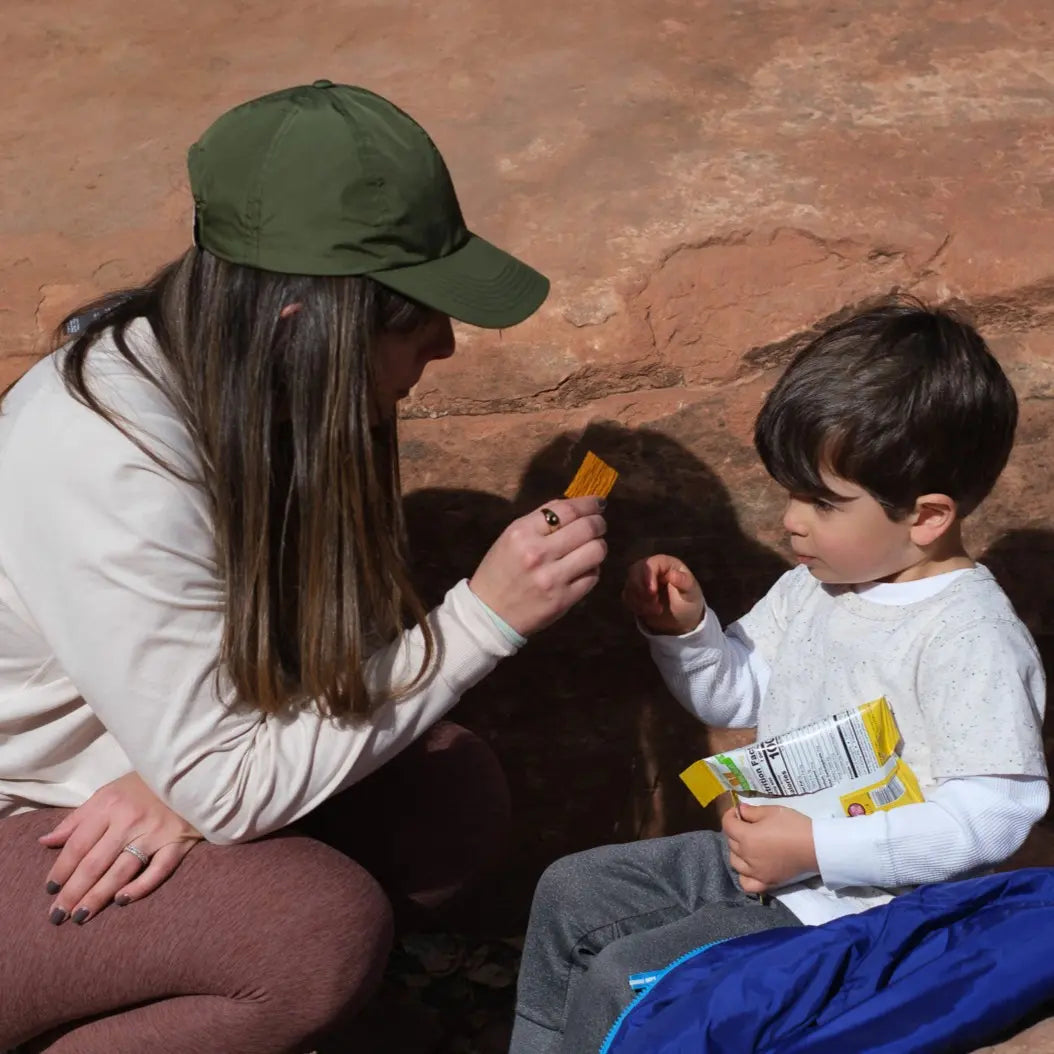 Woman giving her child a TASU Fruit Chip