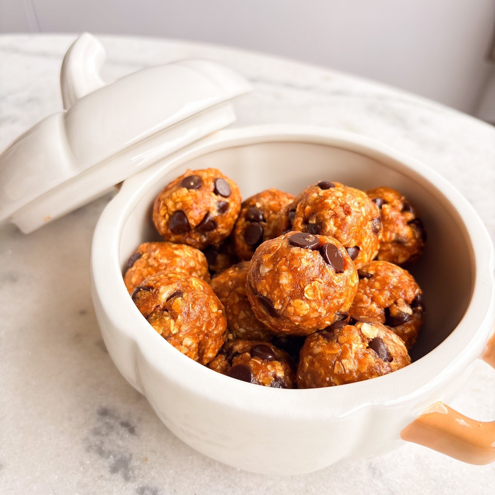 Banana protein balls in a white bowl